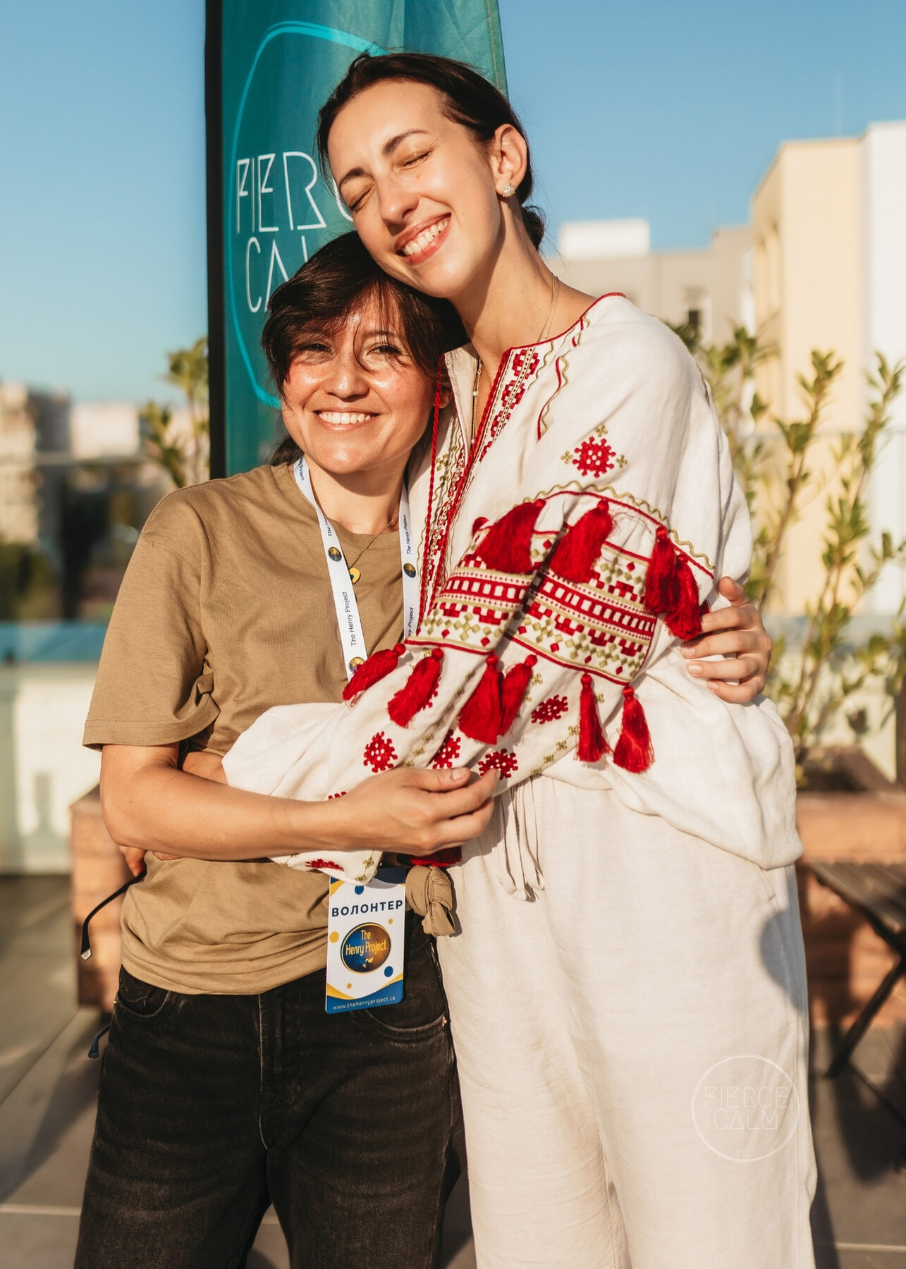 Two Fierce Calm community members smiling together outdoors