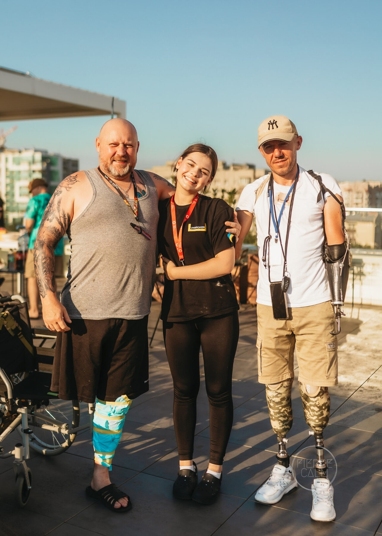 A Fierce Calm team member standing with two participants
