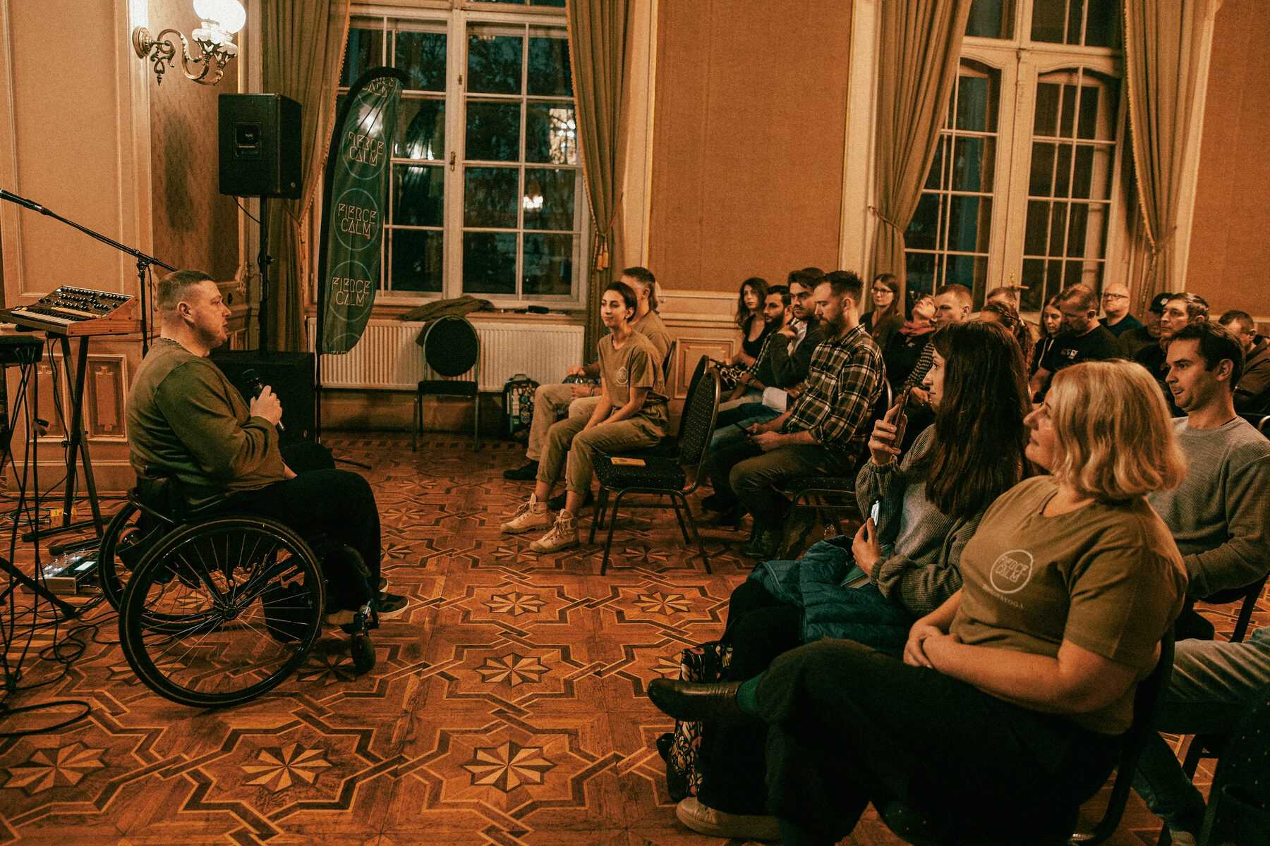 A Fierce Calm gathering with a speaker and seated audience