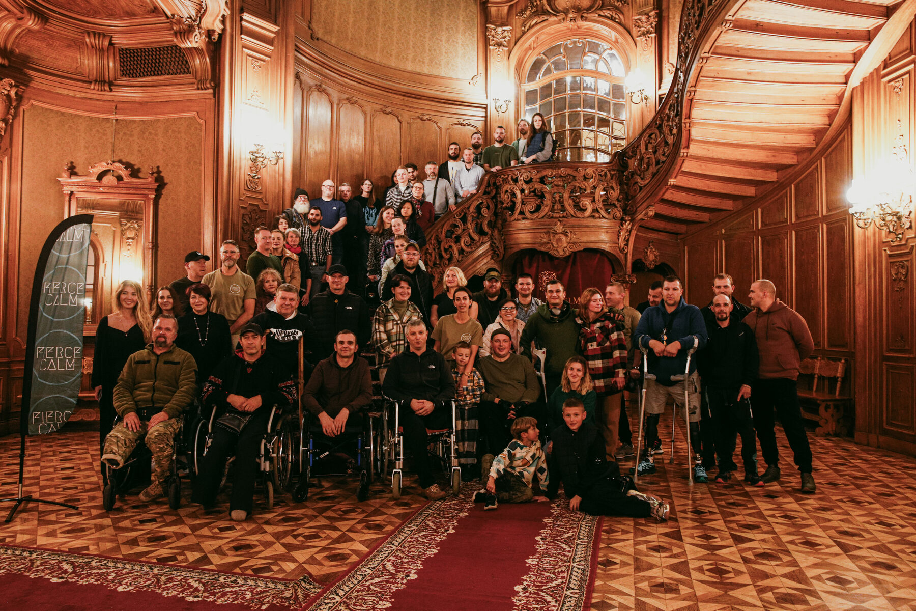 Fierce Calm community gathered on a grand staircase