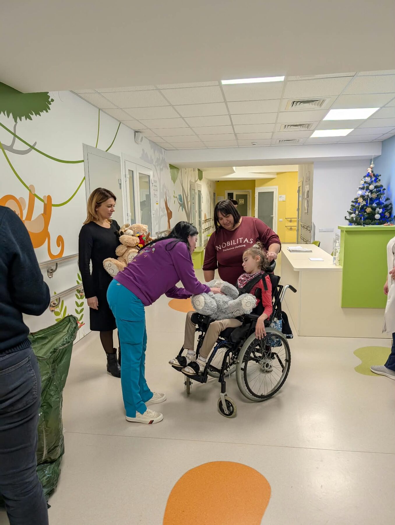 A child receiving care with a rehabilitation team in a hospital