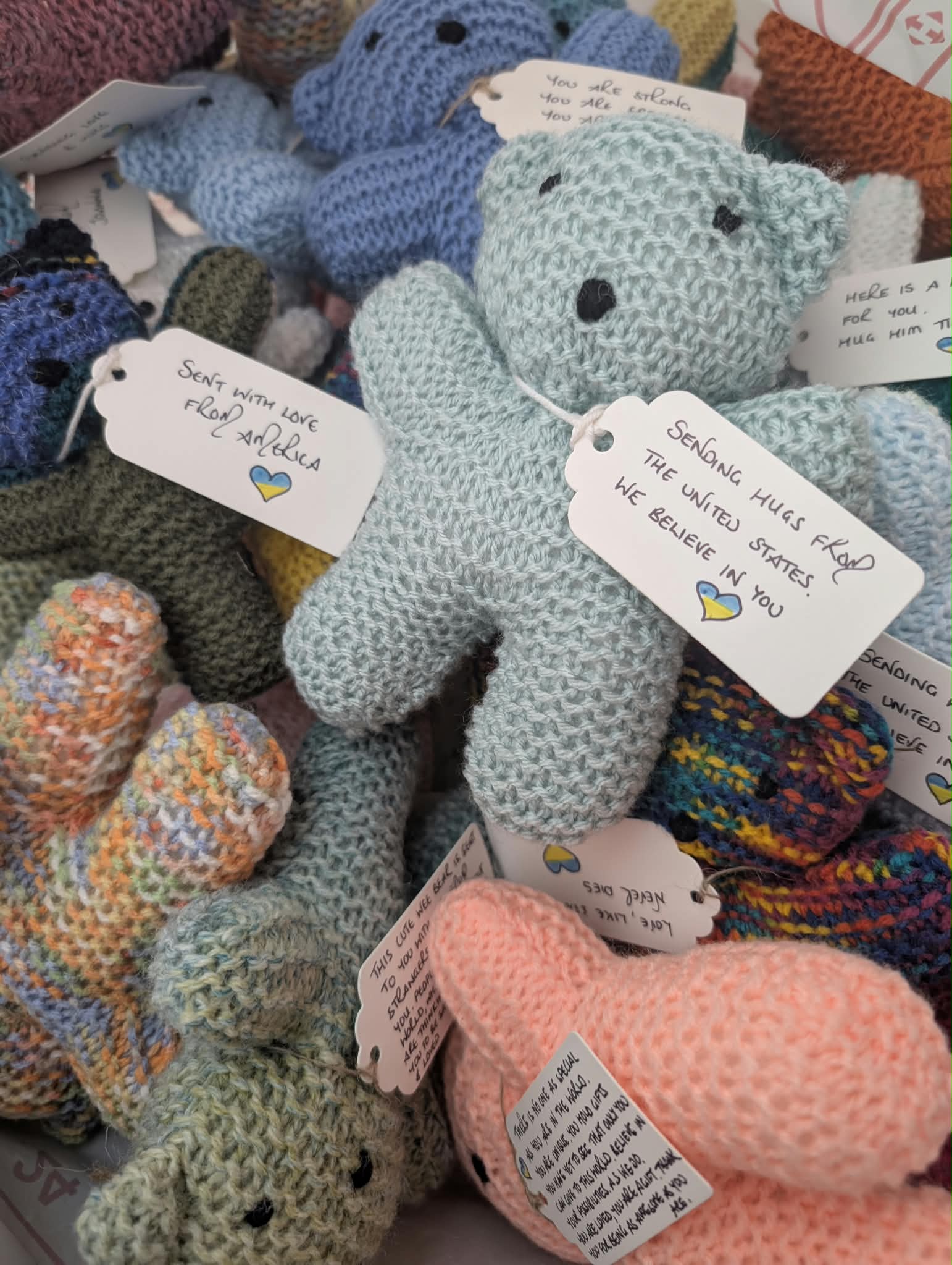Handmade knitted bears with handwritten messages for children