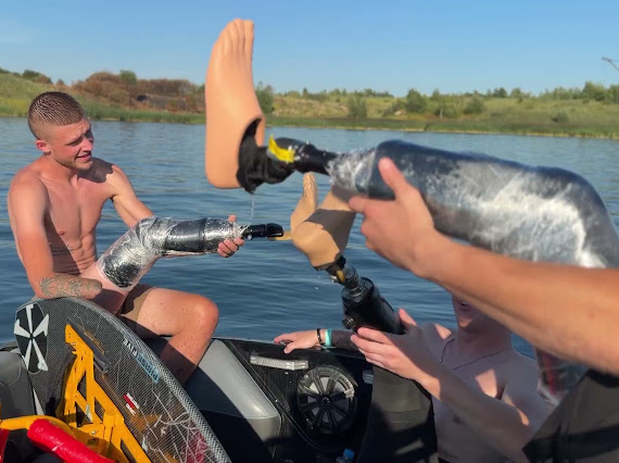A veteran with a prosthetic arm taking part in an adaptive watersports session