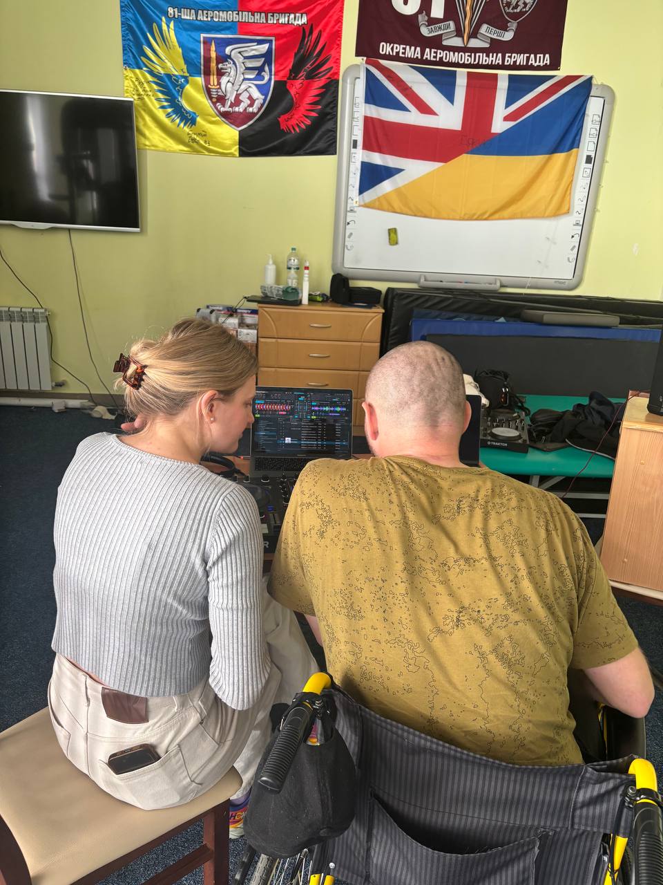 A therapist and participant exploring music together at a DJ session